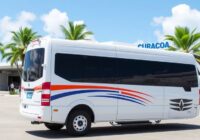 Shuttle van at Curacao Airport with palm trees